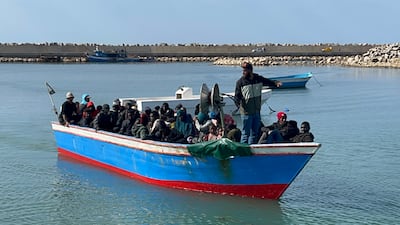 Migrants, who were rescued at sea by the Libyan Coast Guard after their boat sank in the Mediterranean, arrive on a boat in the port of Garaboli, east of Tripoli, Libya, in April 2023. EPA