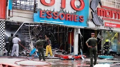 Emergency crews at the scene of the fire in Sharjah Industrial Area.