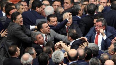 Members of parliament from the ruling AK Party and the main opposition Republican People’s Party scuffle during a debate on proposed constitutional changes on January 11, 2017. Reuters