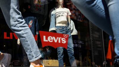 People pass by a Levi Strauss store in New York City, US. The jeans maker Levi priced its IPO at $17 share, just above its target range of $14 to $16. Photo: Reuters