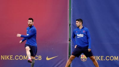 Barcelona's Lionel Messi and Luis Suarez attend a training session at the Joan Gamper Sports City in Barcelona ahead of the La Liga match against Sevilla. EPA