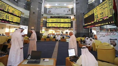 Investors monitor trading screens at the Abu Dhabi Securities Exchange. Reuters