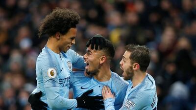 Manchester City's Jesus celebrates scoring their first goal with Leroy Sane and Bernardo Silva. Reuters
