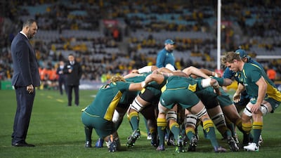 Australia's head coach Michael Cheika, left, wants to give his side time to settle down as he keeps the 2019 Rugby World Cup in mind. David Moir / EPA