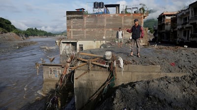 A house is covered in mud and debris after deadly flash floods swept through Nepal. Reuters