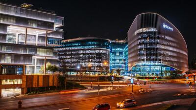 Lights illuminate the windows of an office in the Sandton district of Johannesburg, South Africa. Analysts said the country's cash-strapped power utility, should be broken up and sold to private investors rather than being rescued. Photo: Bloomberg