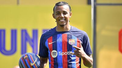 FC Barcelona's new french defender Jules Kounde poses for pictures during his presentation ceremony at the Joan Gamper training ground in Sant Joan Despi, near Barcelona, on August 1, 2022. (Photo by Pau BARRENA / AFP)