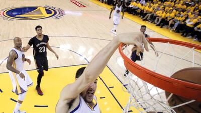 Golden State Warriors guard Klay Thompson dunks against the New Orleans Pelicans in his team's NBA play-offs victory on Monday. Carlos Avila / EPA / April 20, 2015