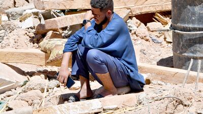 A man cries as he sits on the rubble of a house in the village of Tiksit, south of Adassil, two days after a devastating 6. 8-magnitude earthquake struck the country. Moroccans on September 10 mourned the victims of a devastating earthquake that killed more than 2,000 people as rescue teams raced to find survivors trapped under the rubble of flattened villages. AFP