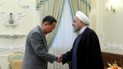 In this photo released by an official website of the office of the Iranian Presidency, President Hassan Rouhani, right, greets North Korean Foreign Minister Ri Yong Ho. Iranian Presidency Office via AP