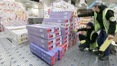 Airline LAN workers organise boxes of flowers to be exported ahead of Valentine’s Day in Bogota’s airport. Jose Miguel Gomez / Reuters