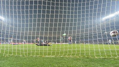 Argentina's Javier Pastore, unseen, scores his side's second goal past Paraguay keeper Justo Villar to make it 2-0 in the Copa America semi-final. Nelson Almeida / AFP