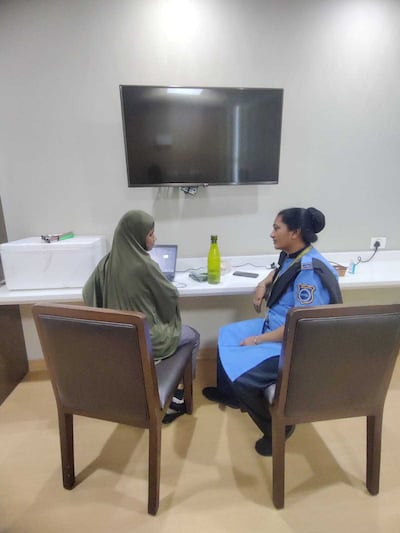 Ayesha taking the history of a patient. She is among the eight Medical Tactile Examiners — all visually impaired — who have been trained to screen for lumps, cysts or any other abnormality in women and help raise awareness about breast cancer in India. Credit: Enable India