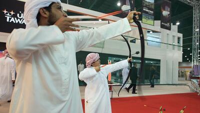Visitors test their archery skills at Laporte shooting stall. Ravindranath K / The National
