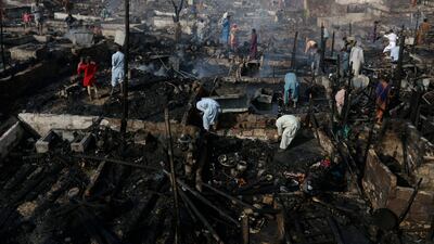 The fire destroyed about 100 huts but no-one was injured. AP Photo