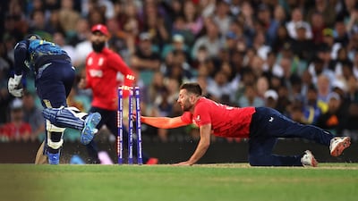 Wanindu Hasaranga of Sri Lanka is run out by Mark Wood of England. Getty