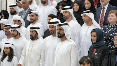 Sheikh Mohammed bin Rashid (front row 3rd right), Sheikh Mohamed bin Zayed (front row 4th right), Sheikh Tahnoon bin Mohamed, Ruler's Representative in Al Ain Region (front row 5th right) and Sheikh Hamdan bin Mohammed (front row 6th right) stand for a photograph with members of Adheedak Group, during an iftar reception at Al Bateen Palace. Seen with Jameela Salem Al Muhairi, UAE Minister of State for Public Education Affairs (front row 2nd right). Eissa Al Hammadi for the Ministry of Presidential Affairs