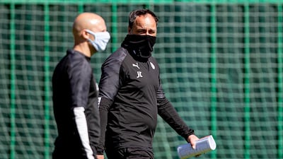 Slavia Prague manager Jindrich Trpisovsky, right, during training on Monday. EPA