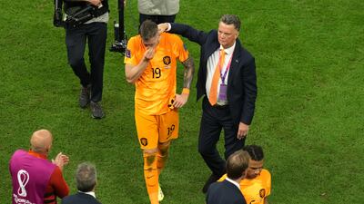 Netherlands manager Louis van Gaal consoles Wout Weghorst after their defeat in the penalty shoot-out against Argentina. PA