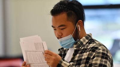 A pupil at the London Academy of Excellence in Tottenham, London, receives his A-level results.