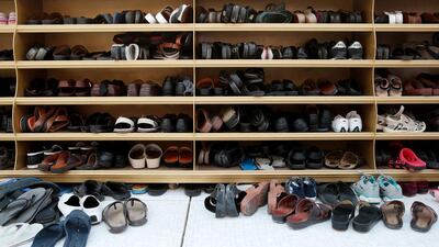 Footwear is stored before Eid prayers. Christopher Pike / The National