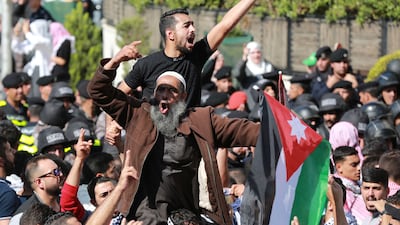 People protest near the Israeli Embassy in Amman on Wednesday as they demonstrate against the killing of hundreds of Palestinians following a strike on a hospital in the Gaza Strip. AFP