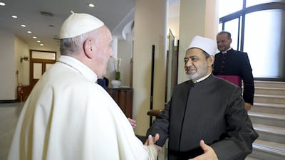 Pope Francis greet the Grand Imam of the Al Azhar, Sheikh Ahmed Al Tayeb at the Vatican last year. Both religious figures are expected in Abu Dhabi next week. AFP