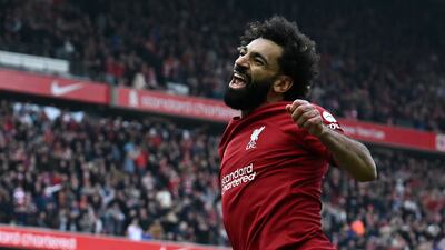 Liverpool's Egyptian striker Mohamed Salah celebrates after scoring their third goal. AFP