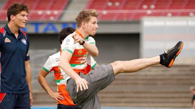 Force India's Nico Hulkenberg practices his Australian Rules Football kicking technique. Darrian Traynor / Getty Images