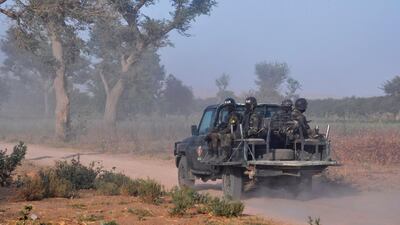 Members of the Cameroonian Rapid Intervention Force patrol on the outskirt of Mosogo in the far north region of the country where Boko Haram has been active since 2013, on March 21, 2019. AFP