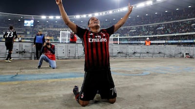 AC Milan's Carlos Bacca celebrates after his part in the team's third goal against Chievo. Alessandro Garofalo / Reuters