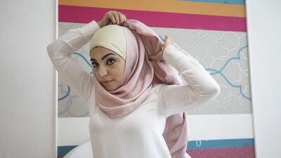 Step 3: Take the long side around the head and hold it at the top and fold the end so that it doesn’t cover the eyes.