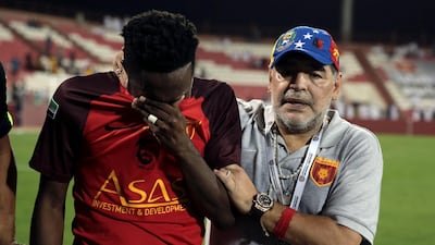 Diego Maradona consoles a Fujairah player after a 1-1 draw against Khorfakkan denied them automatic promotion to the Arabian Gulf League. Christopher Pike / Reuters
