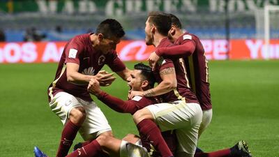 Silvio Romer, centre, is mobbed by teammates after scoring for Club America in their 2-1 victory over Jeonbuk Hyundai Motors in the Club World Cup quarter-final. Toru Yamanaka / AFP