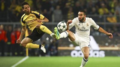 Borussia Dortmund’s Raphael Guerreiro and Real Madrid’s Dani Carvajal in action. Kai Pfaffenbach / Reuters