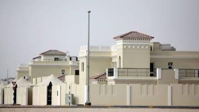 More than 1,300 keys to houses in the Al Falah neighborhood were given out to Emiratis yesterday. Sammy Dallal / The National
