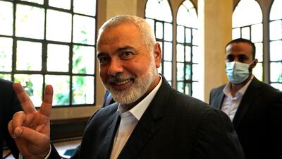 Ismail Haniyeh, the leader of the Palestinian militant group Hamas, flashes the victory sign after his meeting with Lebanese Parliament Speaker Nabih Berri in Beirut