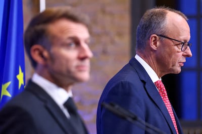 French President Emmanuel Macron, left, and German Chancellor Friedrich Merz and have agreed to abandon the joint fighter jet project. Reuters