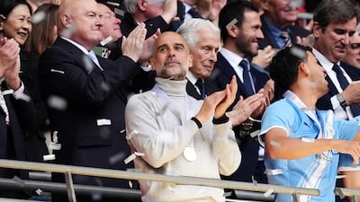 Manchester City manager Pep Guardiola celebrates winning the FA Cup. PA