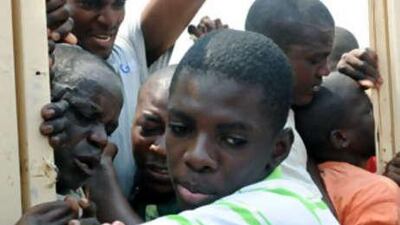 People cramming into a polling station in Angola.