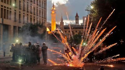 Lebanese security forces clash with protesters near the parliament in central Beirut following a huge chemical explosion that devastated large parts of the Lebanese capital. AFP