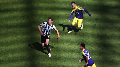 Newcastle United's Luuk De Jong, left, vies for the ball with Swansea City's Pablo Hernandez, top right, and Jonathan De Guzman, bottom right, during their English Premier League soccer match at St James' Park. Scott Heppell / AP Photo