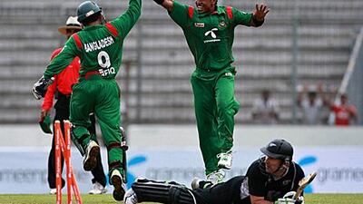 Bangladesh cricketer Mahmudullah, left, jokes with captain Shakib Al Hasan during training yesterday.