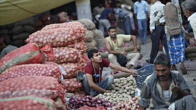 Vendors wait for customers at a wholesale vegetable market in the old quarters of Delhi (REUTERS/Anindito Mukherjee)