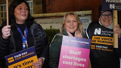 Royal College of Nursing (RCN) General Secretary Pat Cullen joins members on the picket line outside the Royal Victoria Infirmary in Newcastle. PA