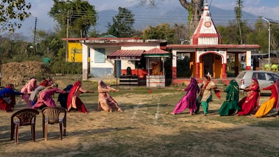 Women compete in a tug-of-war game in the compound of a Hindu temple in Hungloh, a village south of Dharamshala, India. AP