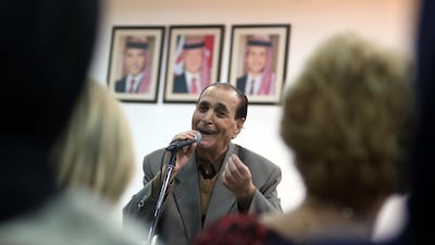Jordanian singer Mohamed Wahib sings with the Beit Al Rowwad ensemble during a concert at Hussein Cultural Center in Amman on March 13, 2018. Khalil Mazraawi / AFP