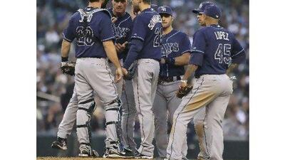 Pitching coach Jim Hickey of the Tampa Bay Rays pays a visit to the mound to talk to starting pitcher Andy Sonnanstine.