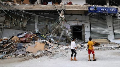 Children check the damage cause by an Israeli strike on a cafe in Khan Yunis in the southern Gaza Strip. AFP