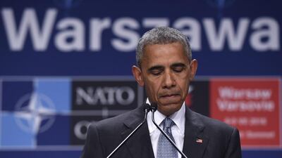 President Barack Obama pauses while speaking about the events in Dallas from the Nato summit in Warsaw on July 9, 2016. Susan Walsh / AP